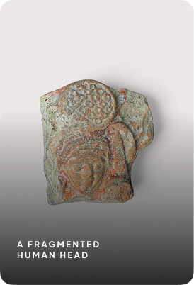 Figure wearing headdress